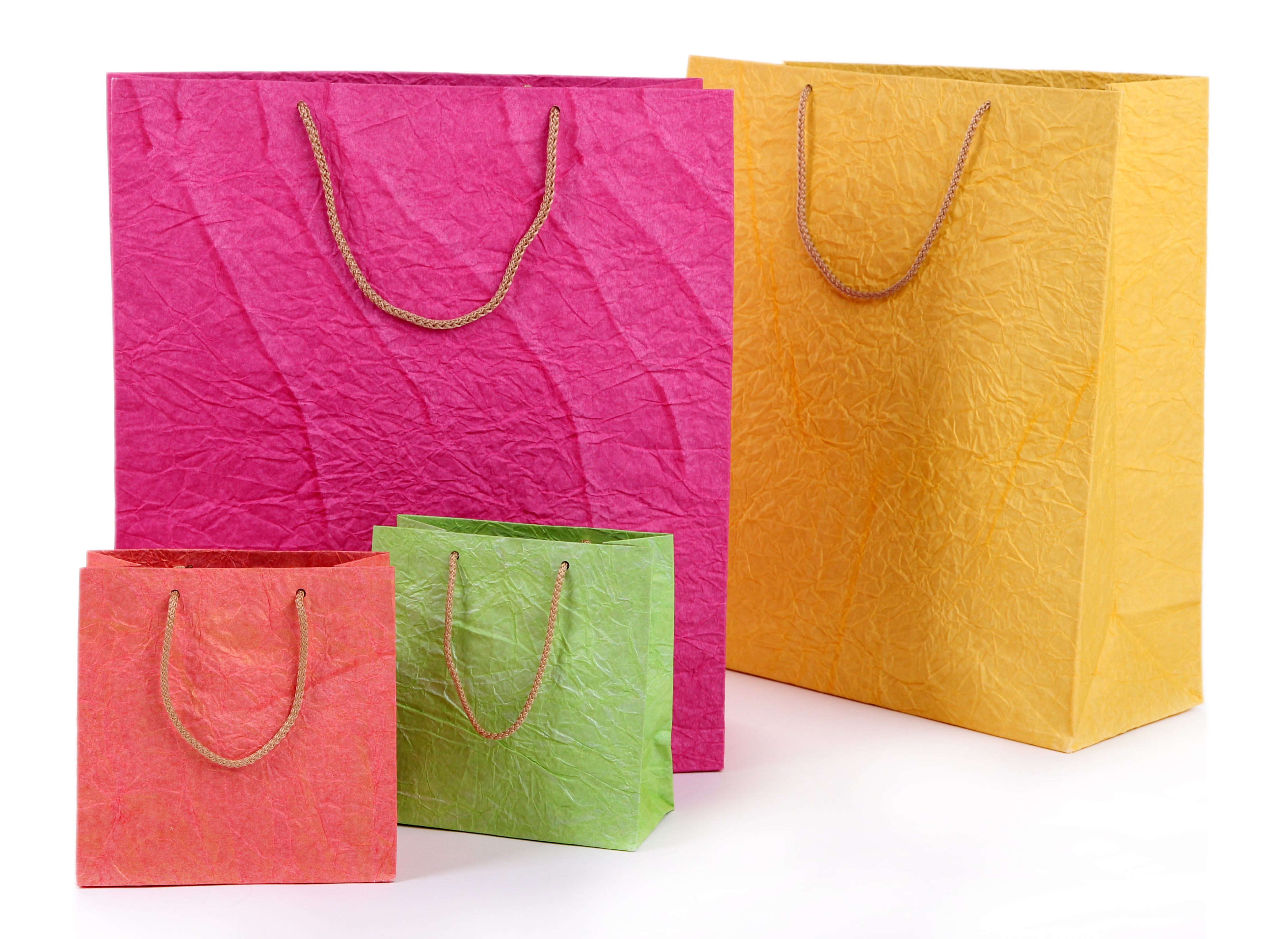 W-cut non-woven shopping bags in multiple colours.